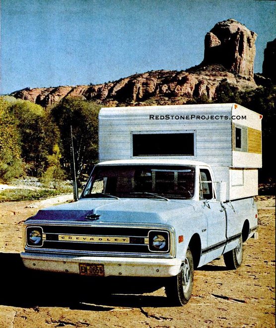 Picture of a telscoping truck camper expanded for sleeping.